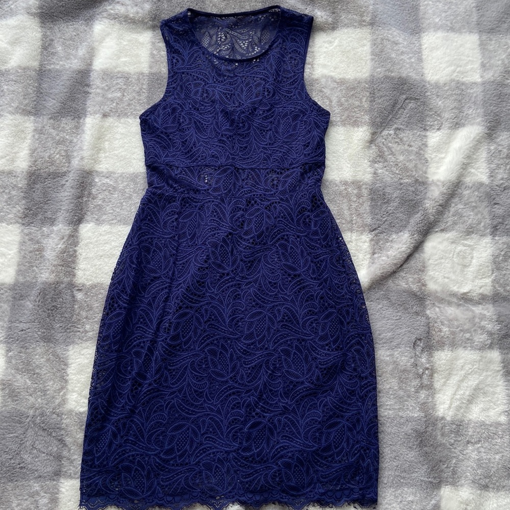Brand new express mini dress. Beautiful blue lace like design